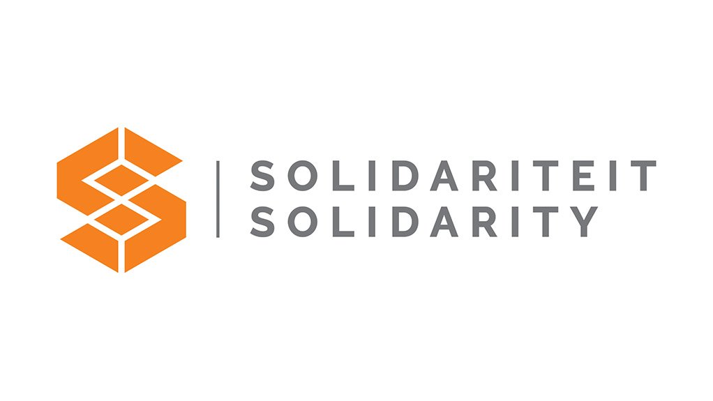 Solidarity: Solidarity shakes a tax fist