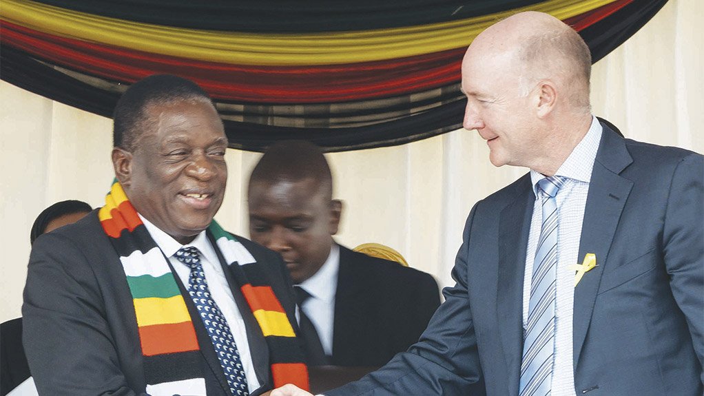 Caption:  	FLASHBACK Zimbabwe’s President Emmerson Mnangagwa shakes hands with Prospect Resources chairperson Hugh Warner at the ground-breaking ceremony for the Arcadia project in December