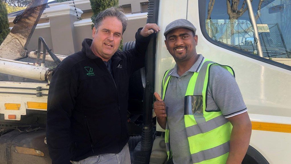 Founder Clive Amsel (left) stands with truck driver Kewin Peterson (right)