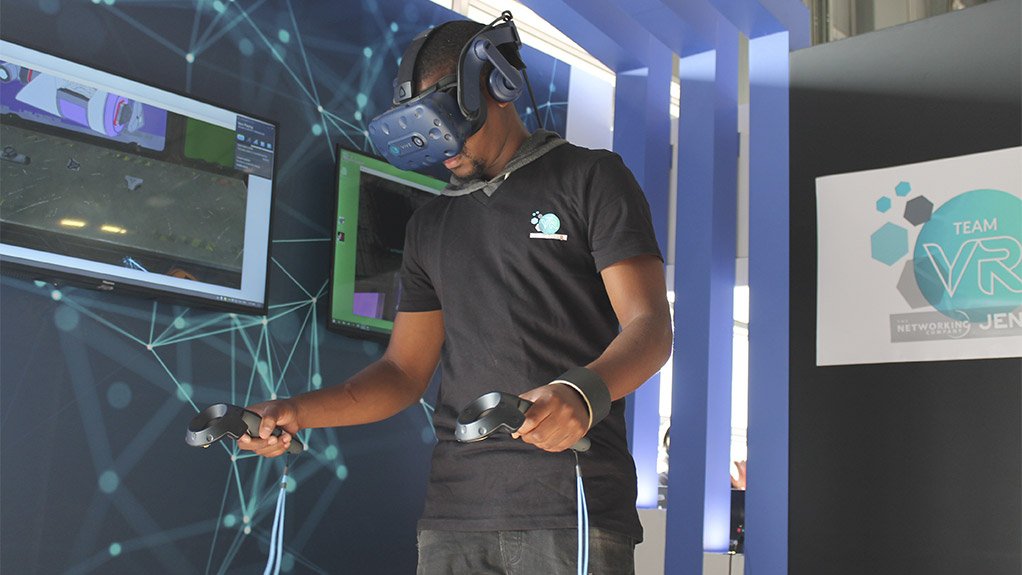 VIRTUAL TEAM-BUILDING
A man explores a virtual simulation at the launch in Rosebank