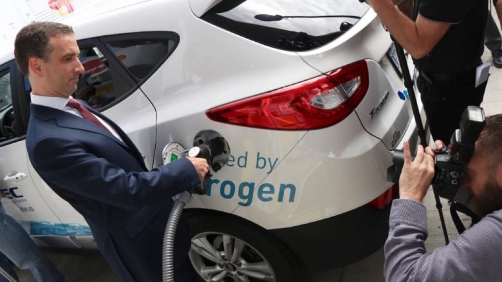 Hydrogen fuel cell car being refuelled.