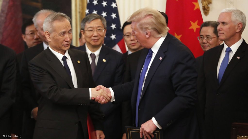 Chinese VP Liu He and US President Donald Trump sign an initial trade deal in Washington.
