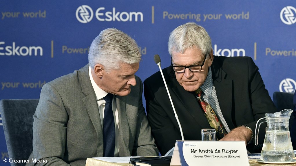 Eskom CEO Andre de Ruyter (left) consults with COO Jan Oberholzer during tate of system media briefing