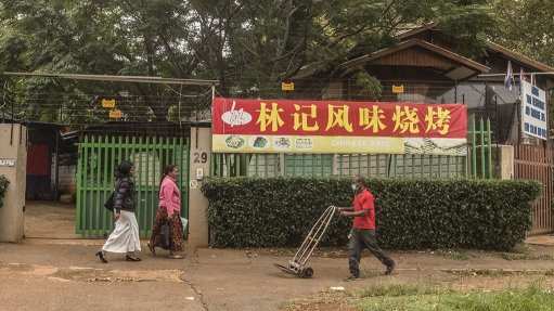 A worker wearing a protective mask in Cyrildene, also known as Johannesburg's 'Chinatown'