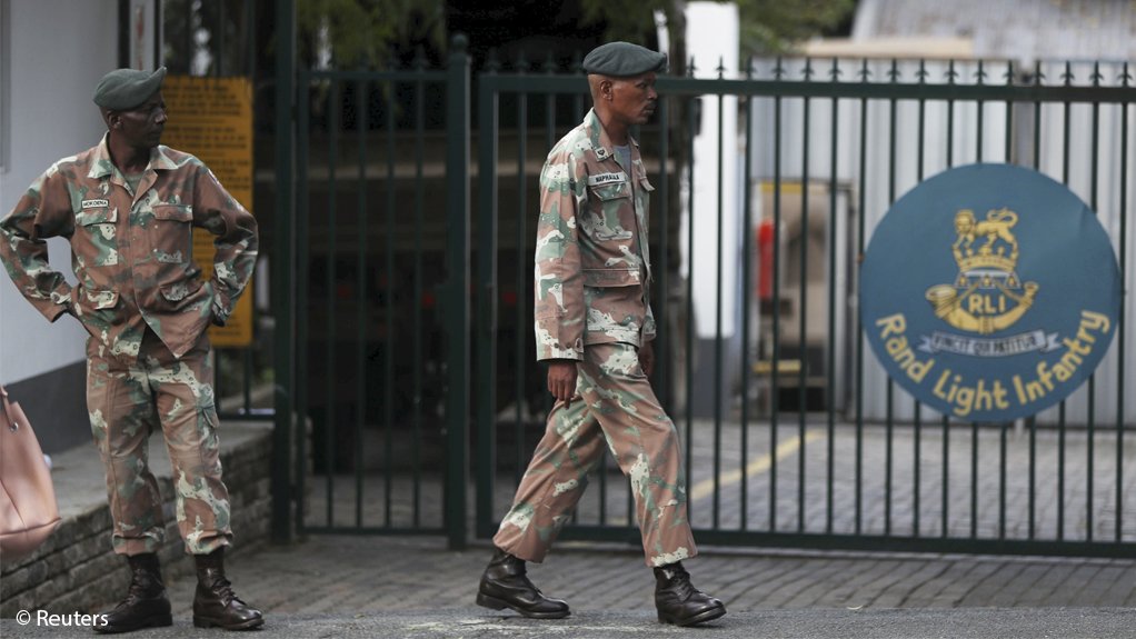 Members of the South African National Defence Force gather at the premises of the Rand Light Infantry in Craighall Park on March 23 in preparedness for mobilisation to help enforce the presidents national lockdown.