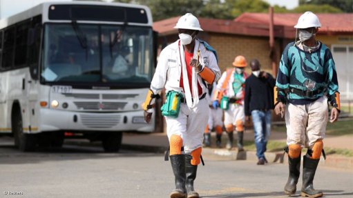 Mineworkers wearing PPE