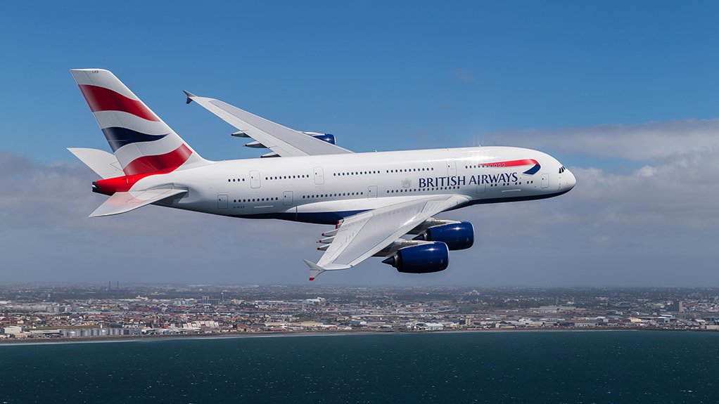 An Airbus A380 of British Airways over Table Bay, with part of Cape Town in the background