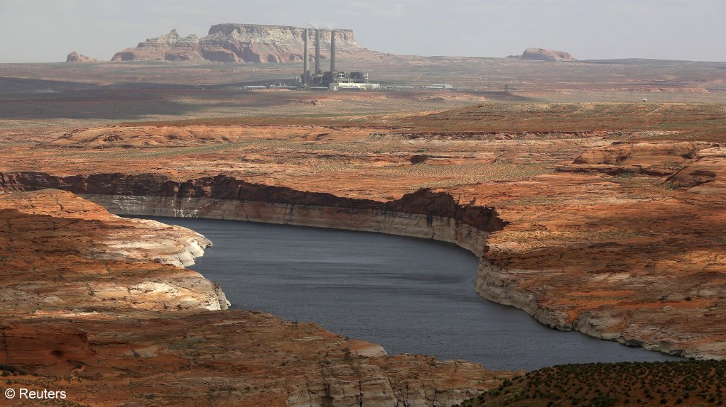 The Navajo foal-fired power plant can be seen near the Colorado river-fed Lake Powell outside Page, Arizona.