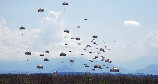 Paratroopers descending, have jumped from an A400M (visible in the right distance). This photo was taken in September 2019 and does not show one of the final, full-strength, certification jumps