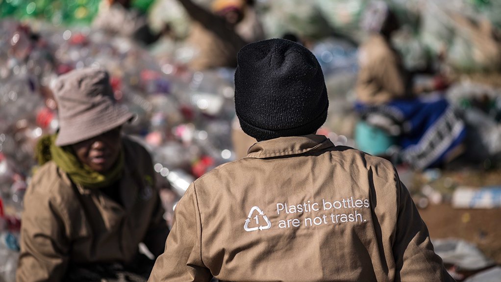 Two reclaimers help sort PET plastic bottles for recycling