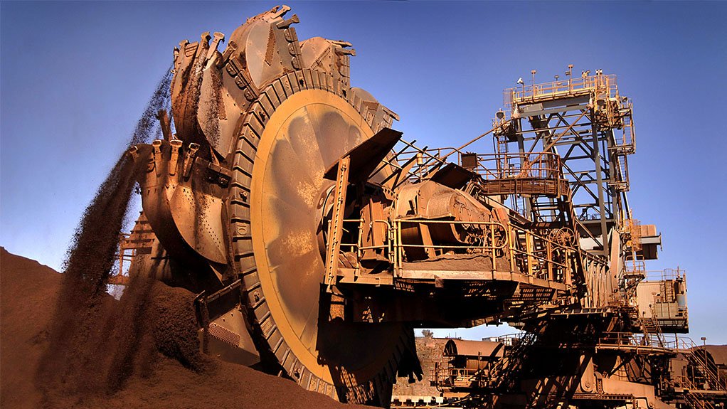 TO MINE ORE NOT TO MINE
A Rio Tinto Group bucket wheel reclaimer shovels iron ore at Karatha Port in North Western Australia