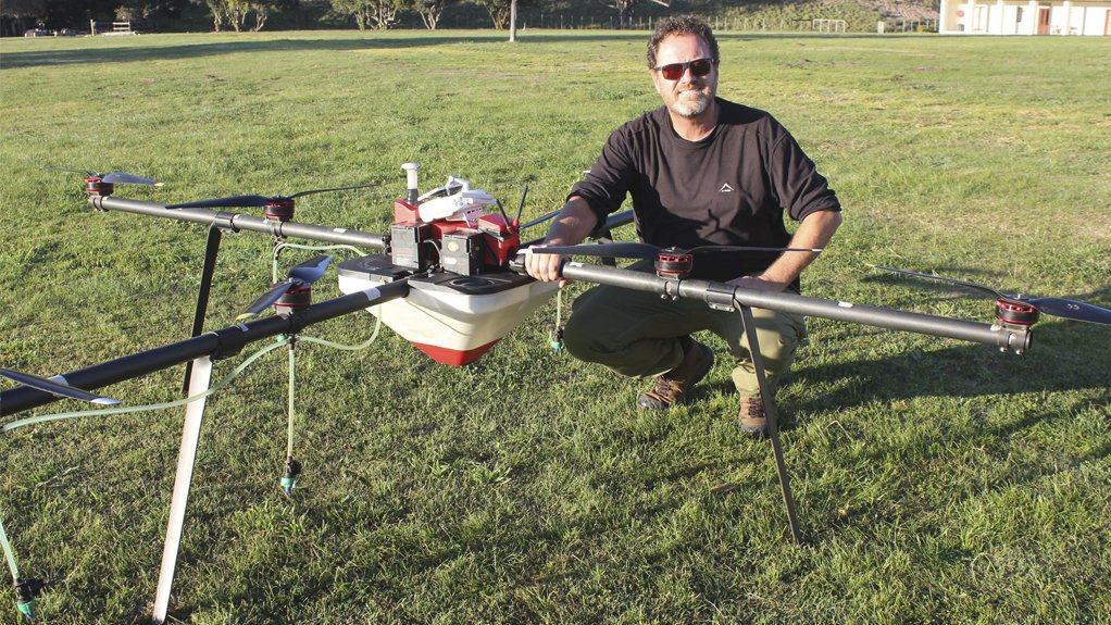 Kammanassie farmer Morné Jonker with the drone sprayer used to fight alien vegetation