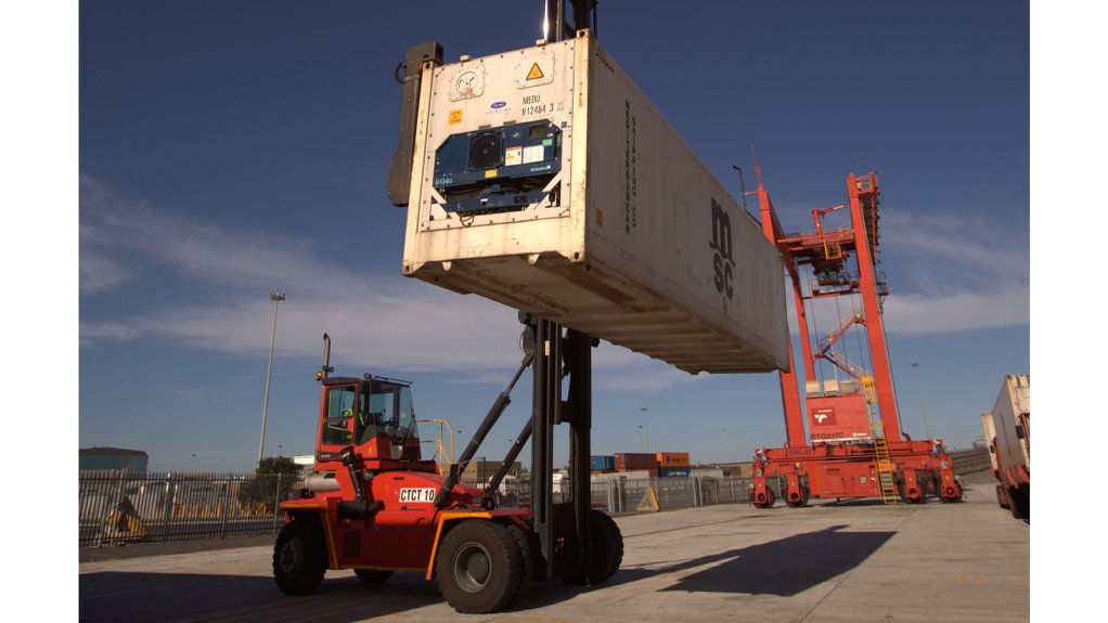 A forklift manoeuvres a reefer unit