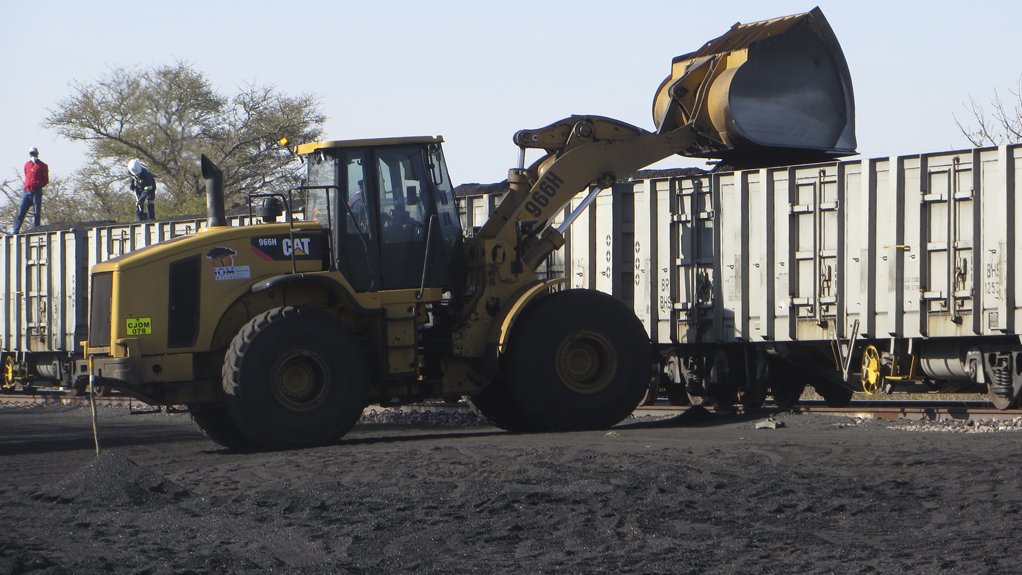 A wheel-loader loads Minergy's first coal export product into a Botswana Railways wagon en route to a South Africa client