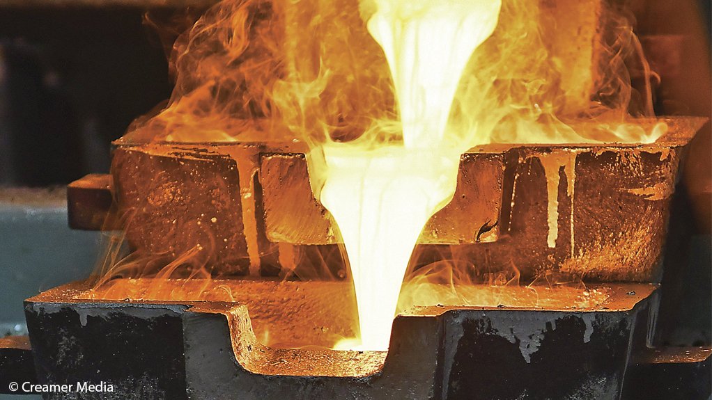 Molten gold flows into ingots at Pan African Resources' Elikhulu tailings retreatment facility