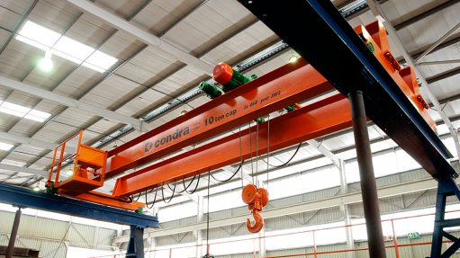DOUBLE-GIRDER OVERHEAD CRANE UNDER TEST

The twin girders are fixed to end-carriages at each end, and alignment of these wheels is critical to prevent wear