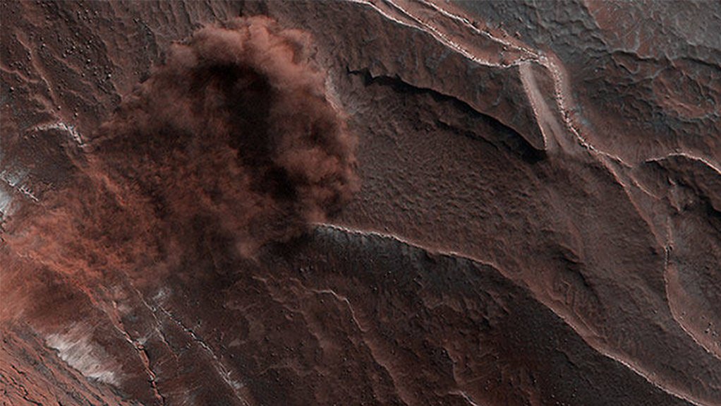 Caught in the act: an avalanche races down an escarpment on Mars.