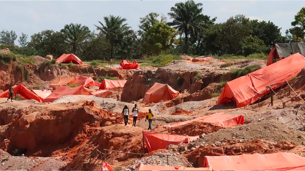 Kasulu mine, Kolwezi, with each orange tarpaulin covering a mining tunnel.