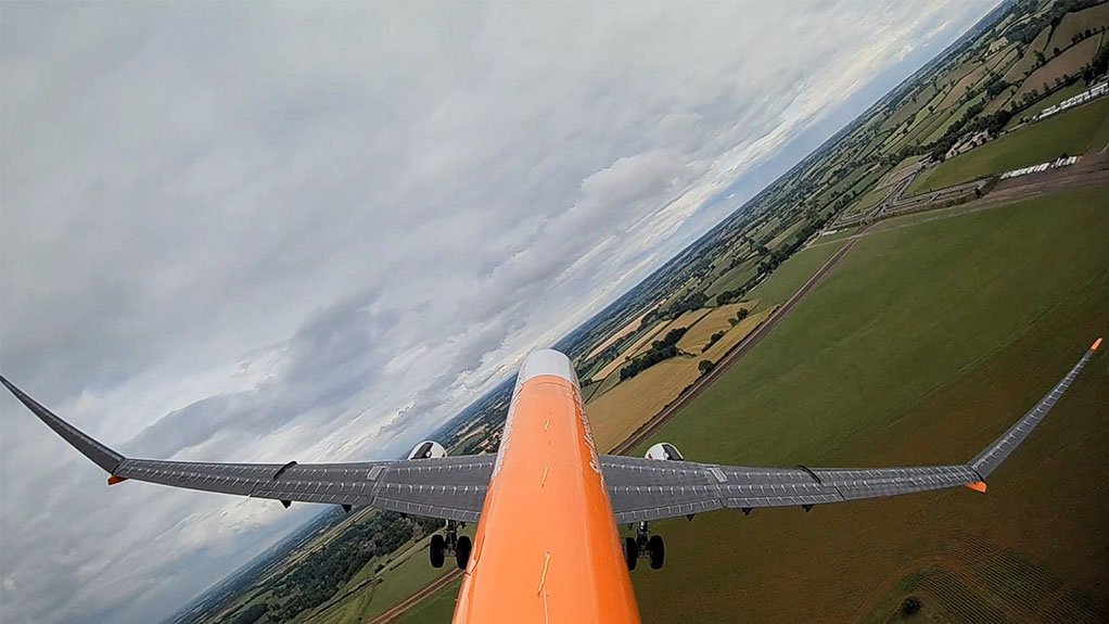 The AlbatrossONE UAV in flight, with the hinged wingtips clearly visible