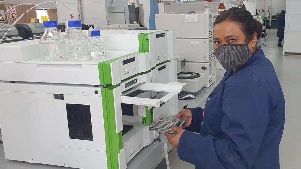 Senior analytical chemist, Lynette Pillay, feeds samples into the new high performance liquid chromatography machine at WearCheck’s transformer laboratory in Durban