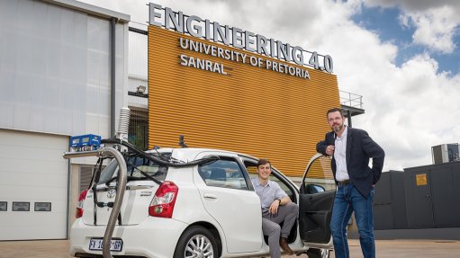 An engineering student and Professor Johan Joubert alongside UP's portable emissions measurement system