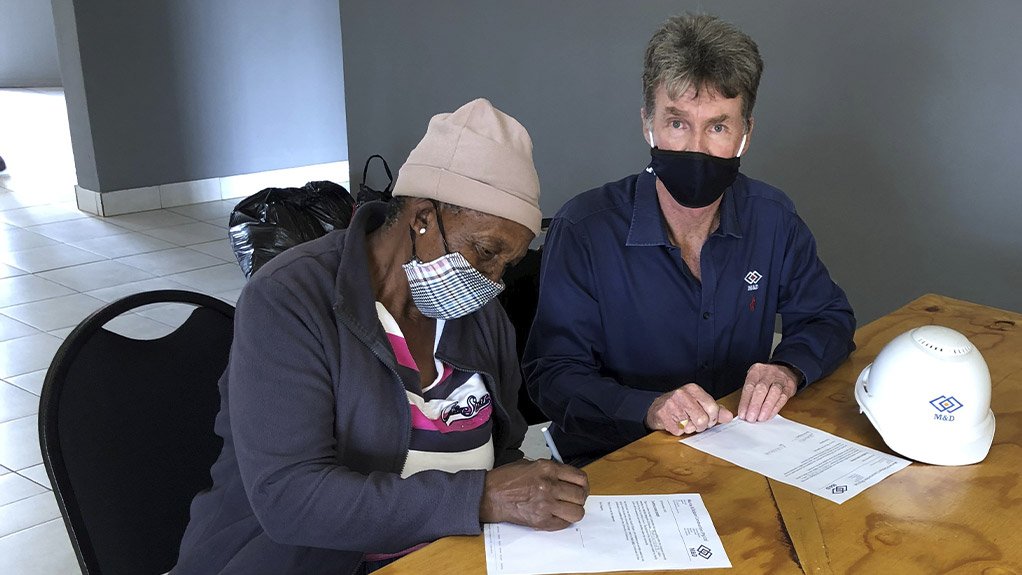 M&D Construction Group gives pensioner and her three sons a house that they can call home  