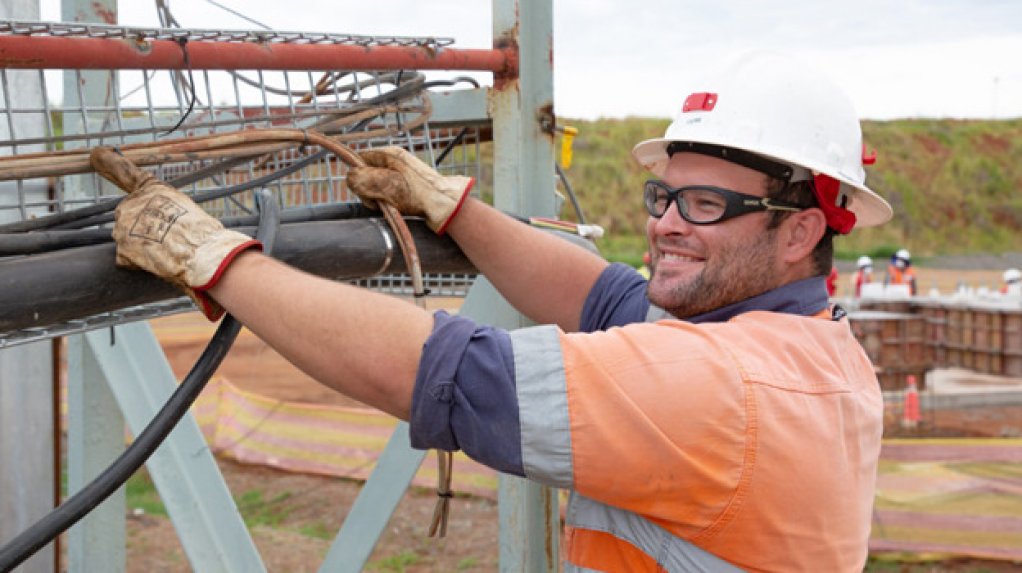 Victor Skinner, a winder technician, installs cables at Shaft 1 new winder house at Platreef.