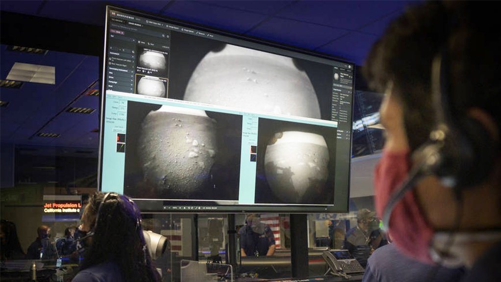 Photo taken in Perseverance mission control at Nasa JPL shortly after the rover landed on Mars, with the first images it transmitted from the Red Planet displayed on the large viewscreen