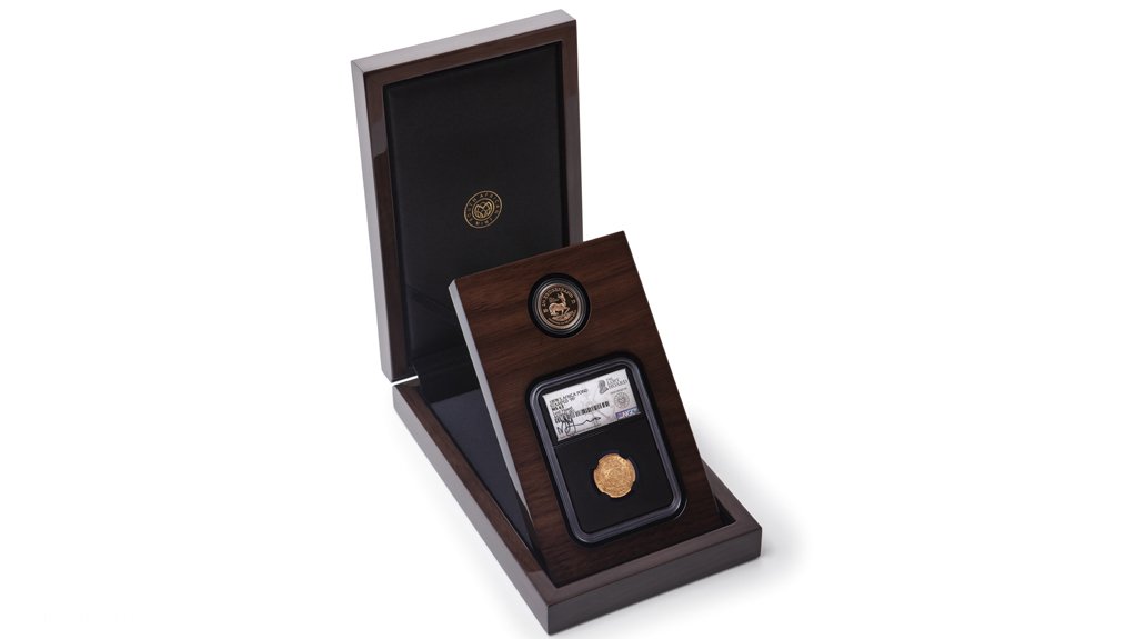 The Kruger half-pond with a Kruger Rand in its box set as sold by the South African Mint