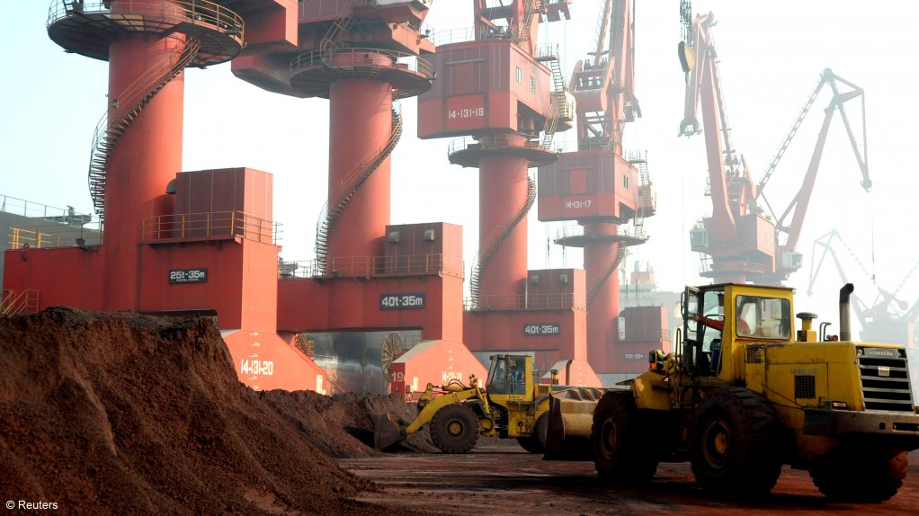 Workers transport soil containing rare earth elements for export at a port in Lianyungang, Jiangsu province. China's rare earth exports hit a five-year low last year.
