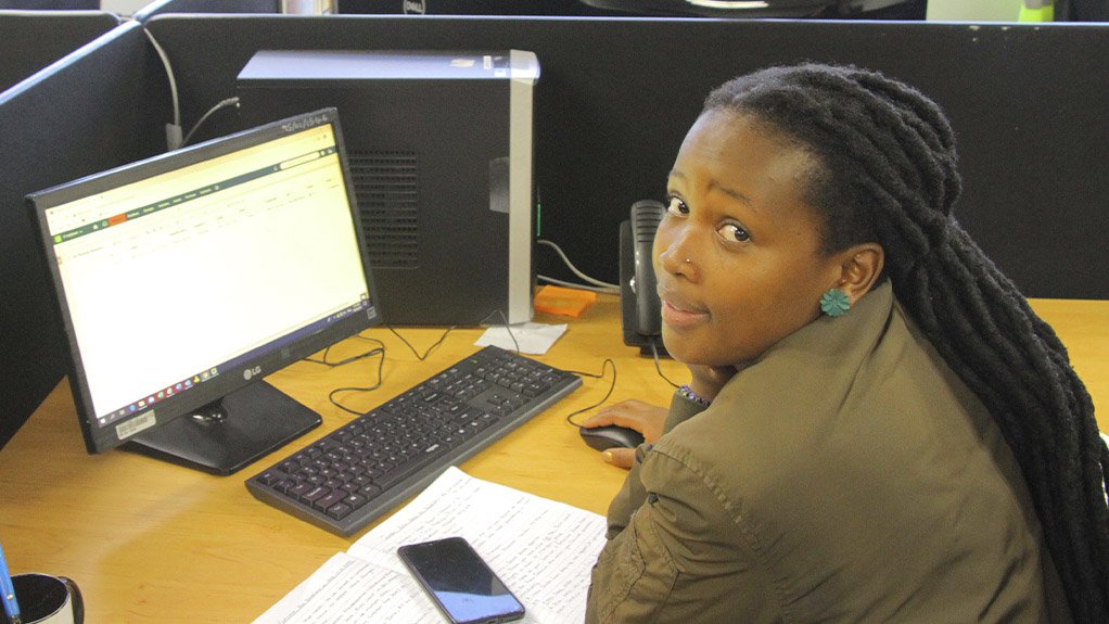 Lulama Ndlovu, IT Support Technician, assisting users who logged calls on the IT system