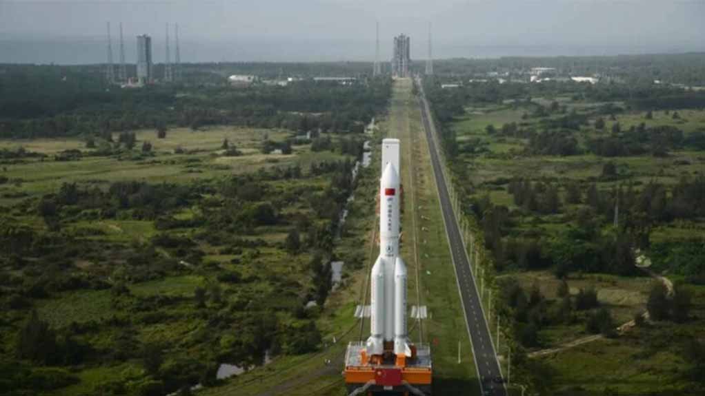 The Long March 5B rocket carrying the Tianhe core module is rolled out to its launchpad