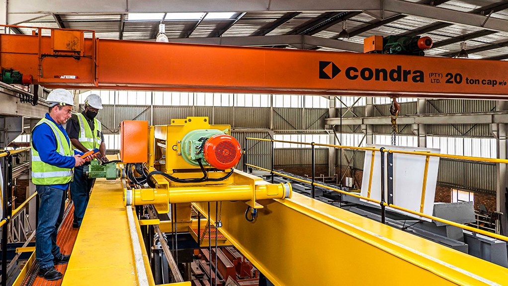 A Condra overhead crane (yellow), similar in overall design to the cranes being manufactured for the new vehicle plant, seen here under test in the Johannesburg factory