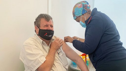 Harmony CEO Peter Steenkamp receiving his Covid-19 vaccination at the Medscheme Health Facility in Florida, Roodepoort.