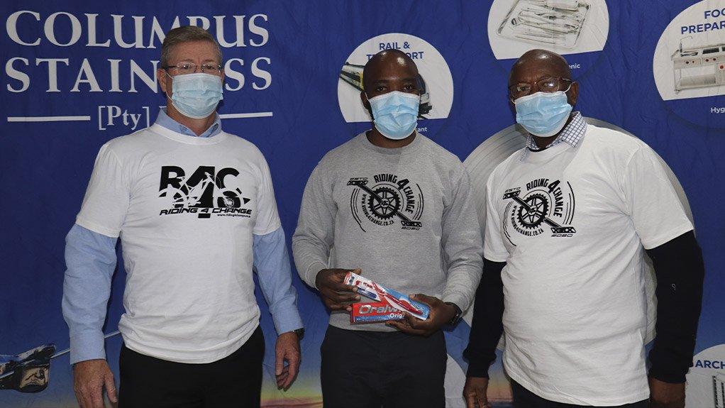 From left to right: Columbus Stainless CEO Johan Strydom, Muzi Khumalo (Ride4Change), Columbus Stainless General Manager Human Resources, Jo Mabhena during the ceremony when the company committed to support the project
