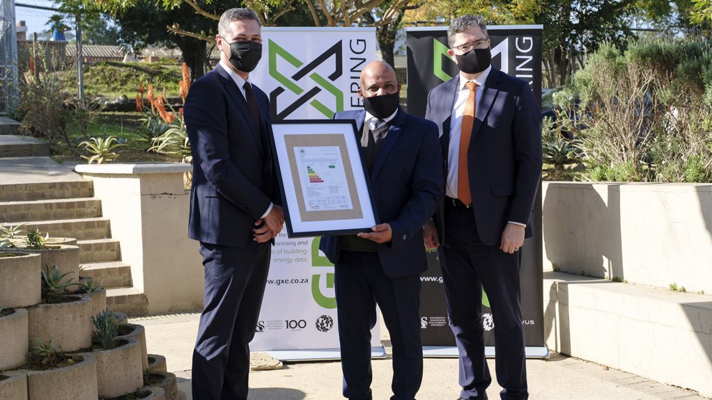 Cloetesville Primary School principal Rodger Cupido (pictured centre) receives the energy performance certificate, and is joined by Western Cape Education Department education planning DDG Salie Abrahams and SU COO professor Stan du Plessis.