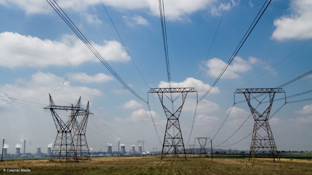 Power lines with Sasol's Secunda complex in the background