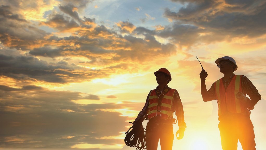 Photo of two engineers working on site