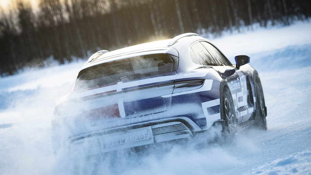 Porsche's newest electric car driving in the snow 