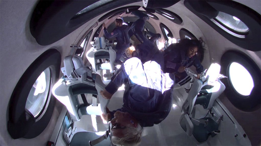 A shot of the interior of VSS Unity’s cabin after it had achieved zero gravity conditions in space, with Sir Richard Branson upsidedown in the foreground and Sirisha Bandla just visible in the background on the right