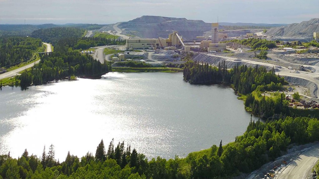 A picture showing a dam and a mining operation in Canada