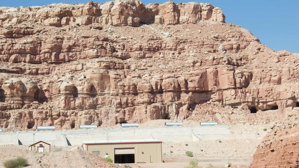 An image showing a hill and a mine administrative building in Utah, US.