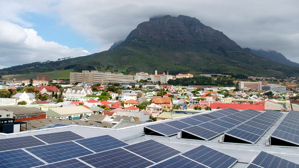 Image of solar rooftops with a Cape mountain in the background