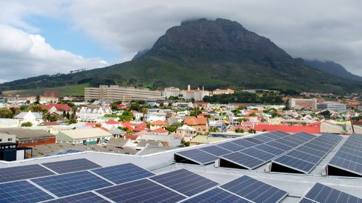 Image of solar rooftops with a Cape mountain in the background
