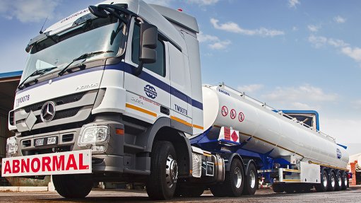 An image of a large Unitrans truck bearing an abnormal loads sign