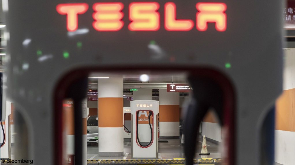 An image showing an electric vehicle charging station in a parking lot.