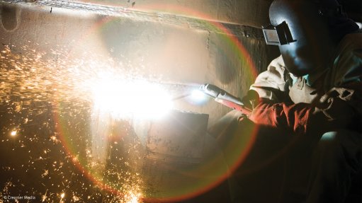 A photo of a worker welding