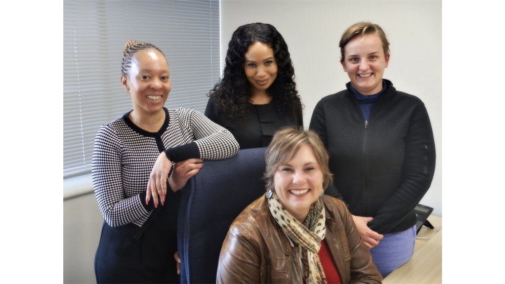 An image of UMS Group employees Nonjabulo Zikhali, Siphiwe Antonette Malepe, Genevieve van Wyk and Esbé Miller (front) 