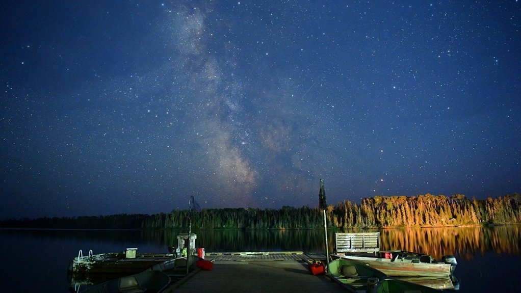 An image showing equipment and the night skies above a mining camp in Ontario, Canada.