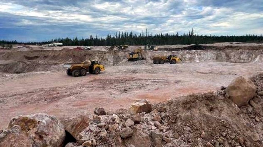 An image of heavy equipment working on a mine site in Canada.